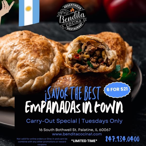 Close-up of golden-brown Argentinean empanadas, one cut open to show a savory meat filling.